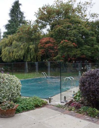 Grandparents swimming pool protected by our frameless glass pool fence