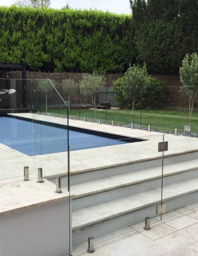 Symmetrical glass pool safety fence with gates
