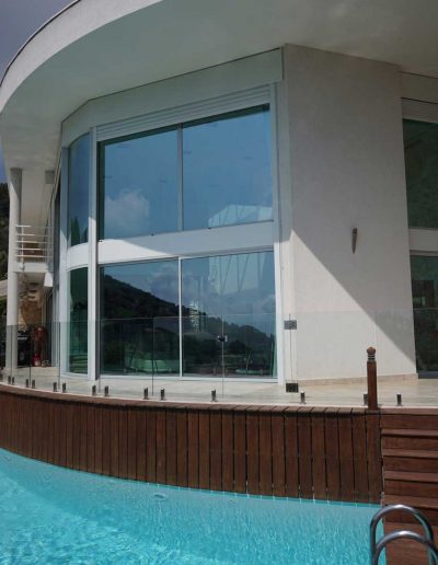 Curved building, curved faceted glass fence